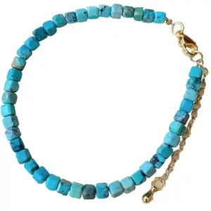 4.4mm turquoise cube bead bracelet with gold-plated clasp laid flat